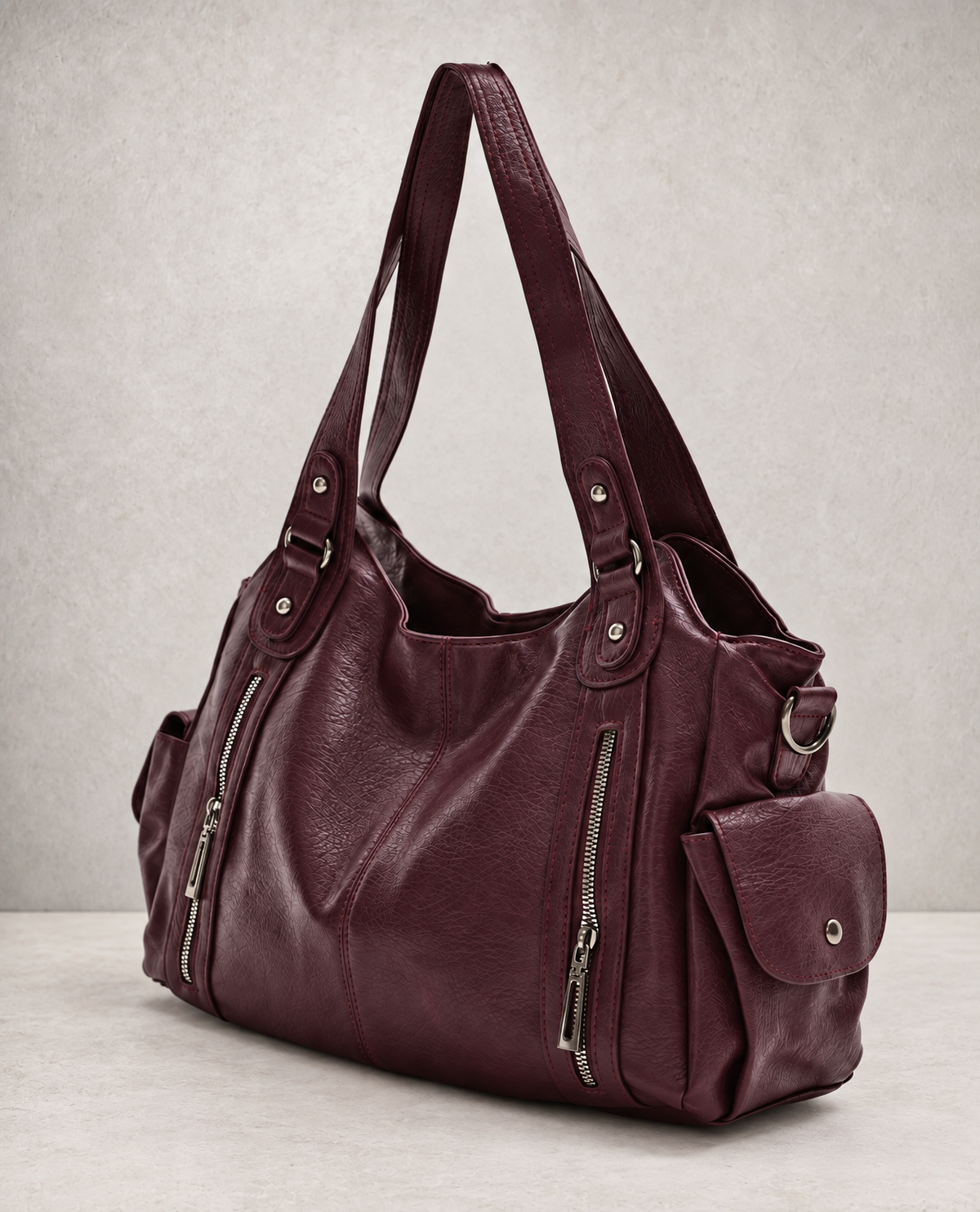 L'Elyn tote bag in burgundy vegan leather, angled view