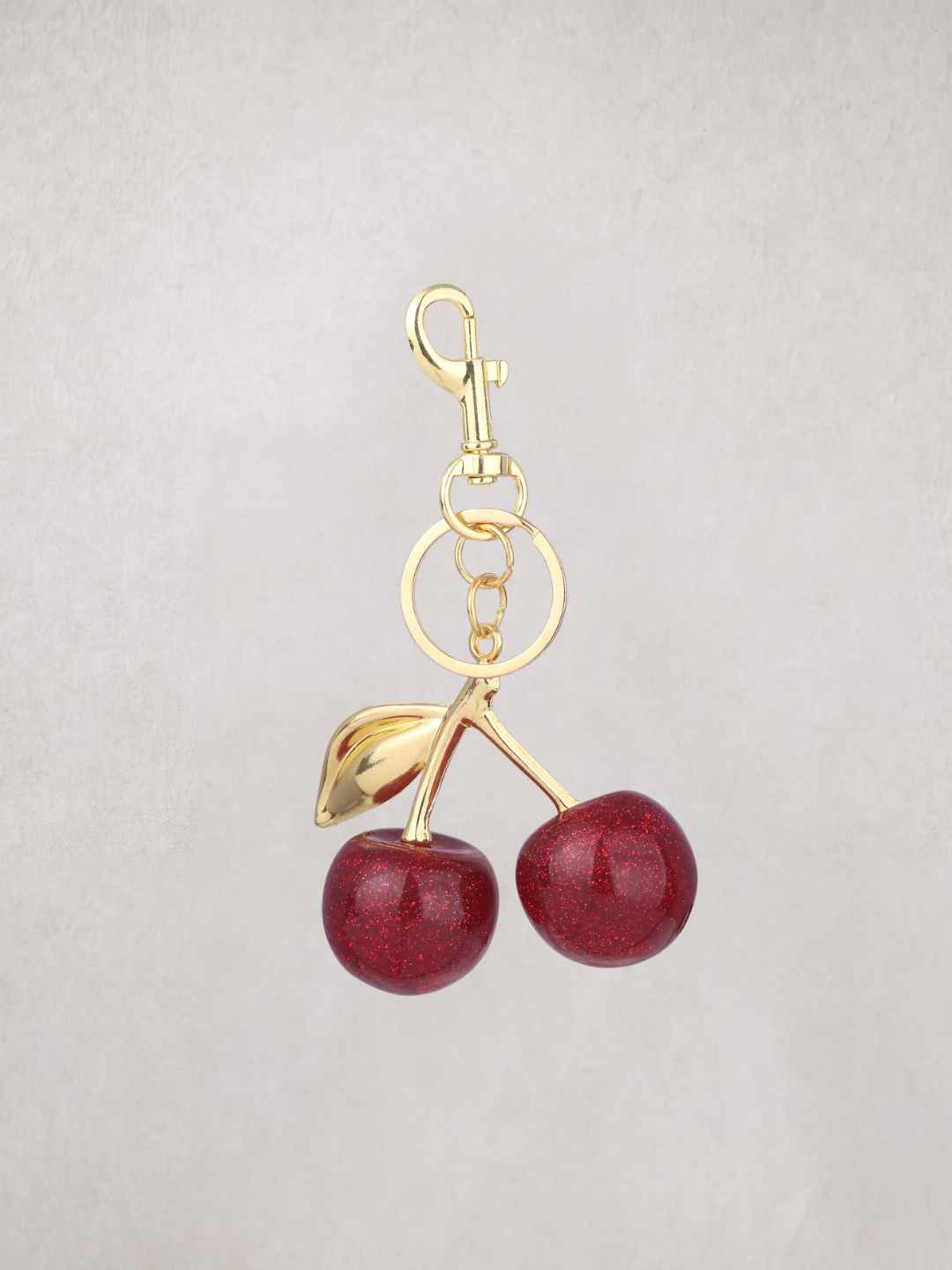 Cherry Charm keychain with gold hardware, product shot
