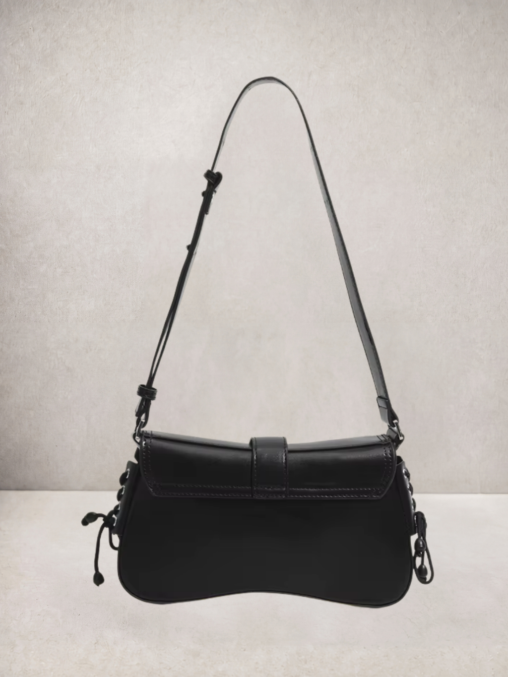 Le Lune bag in black vegan leather with cargo pockets, three-quarter view
