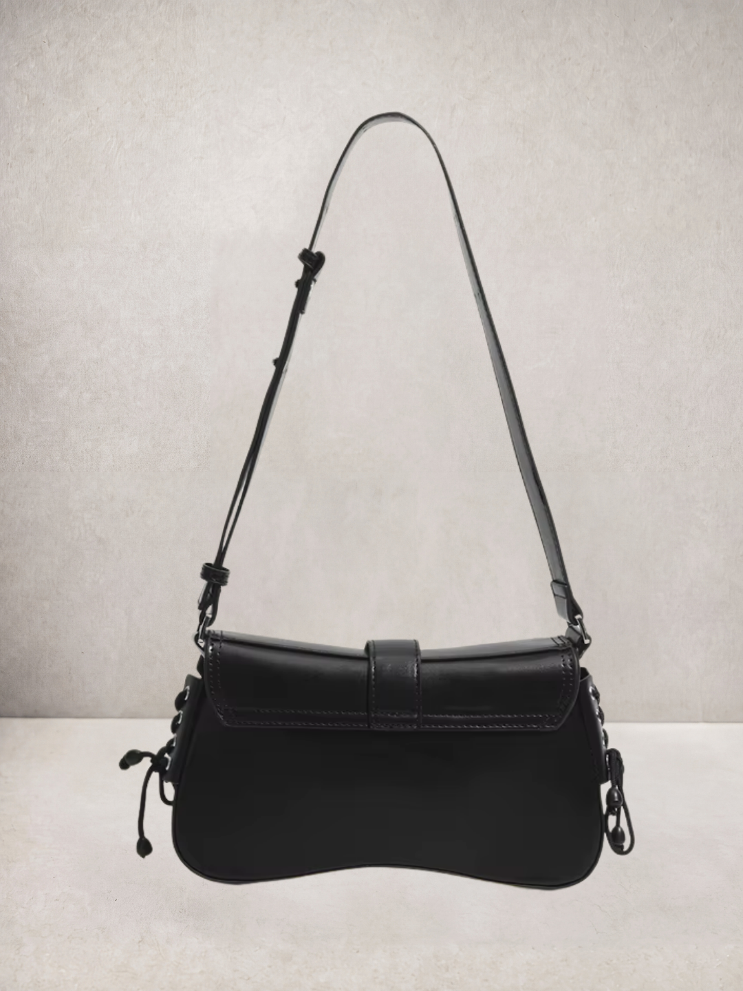 Le Lune bag in black vegan leather with cargo pockets, three-quarter view