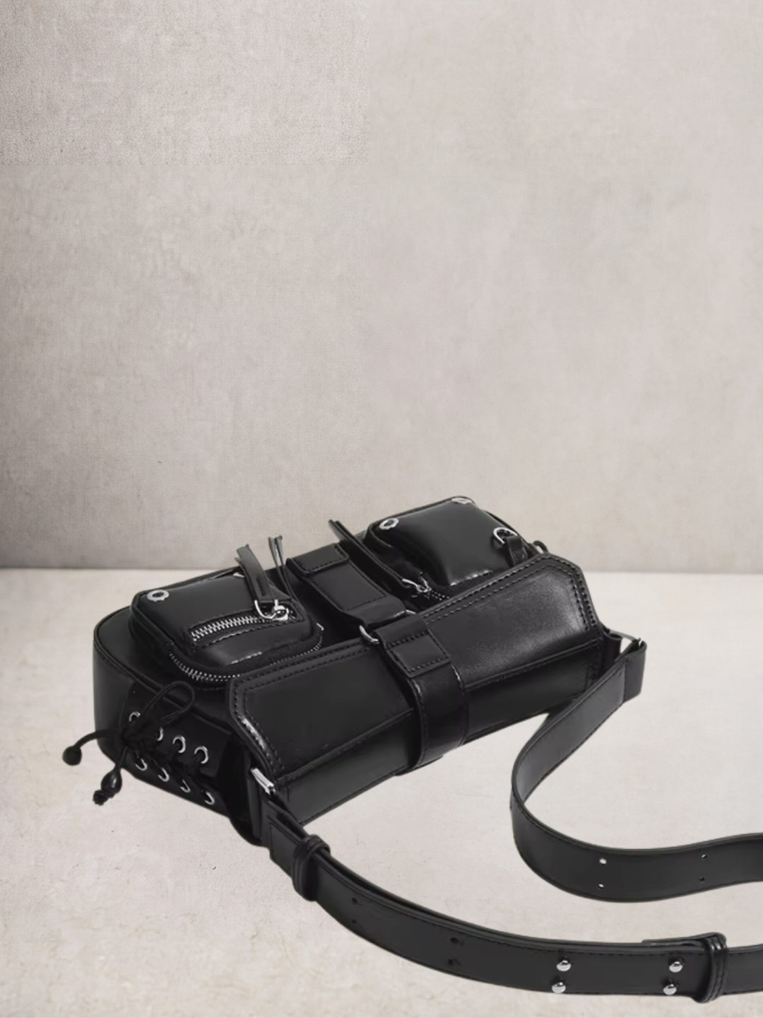 Le Lune bag in black vegan leather, back view showing the adjustable strap