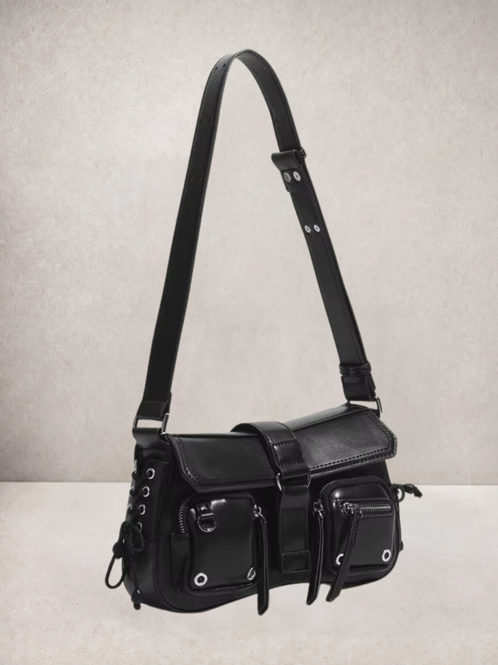 Le Lune bag in black vegan leather with cargo pockets, side view