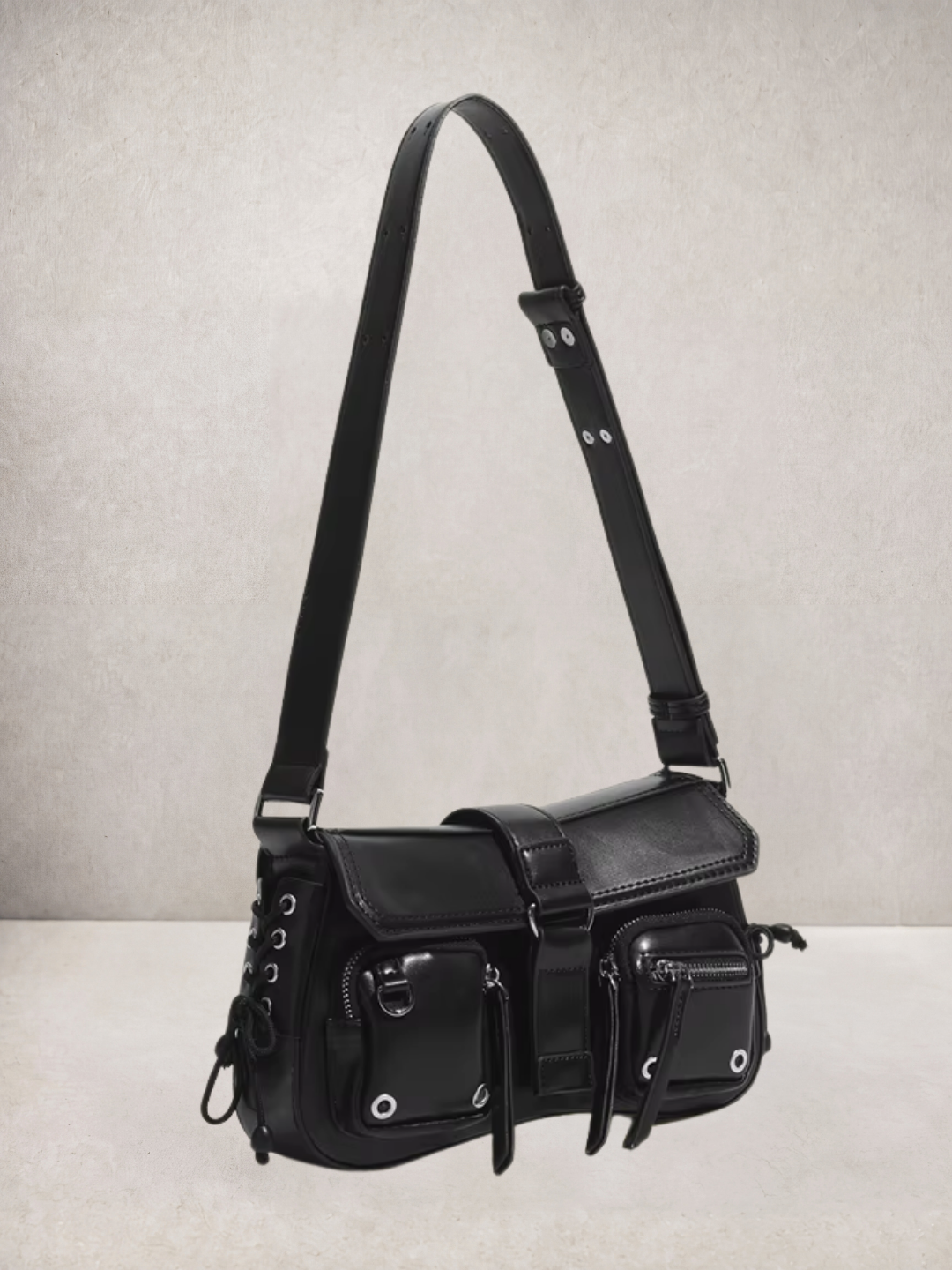 Le Lune bag in black vegan leather with cargo pockets, side view
