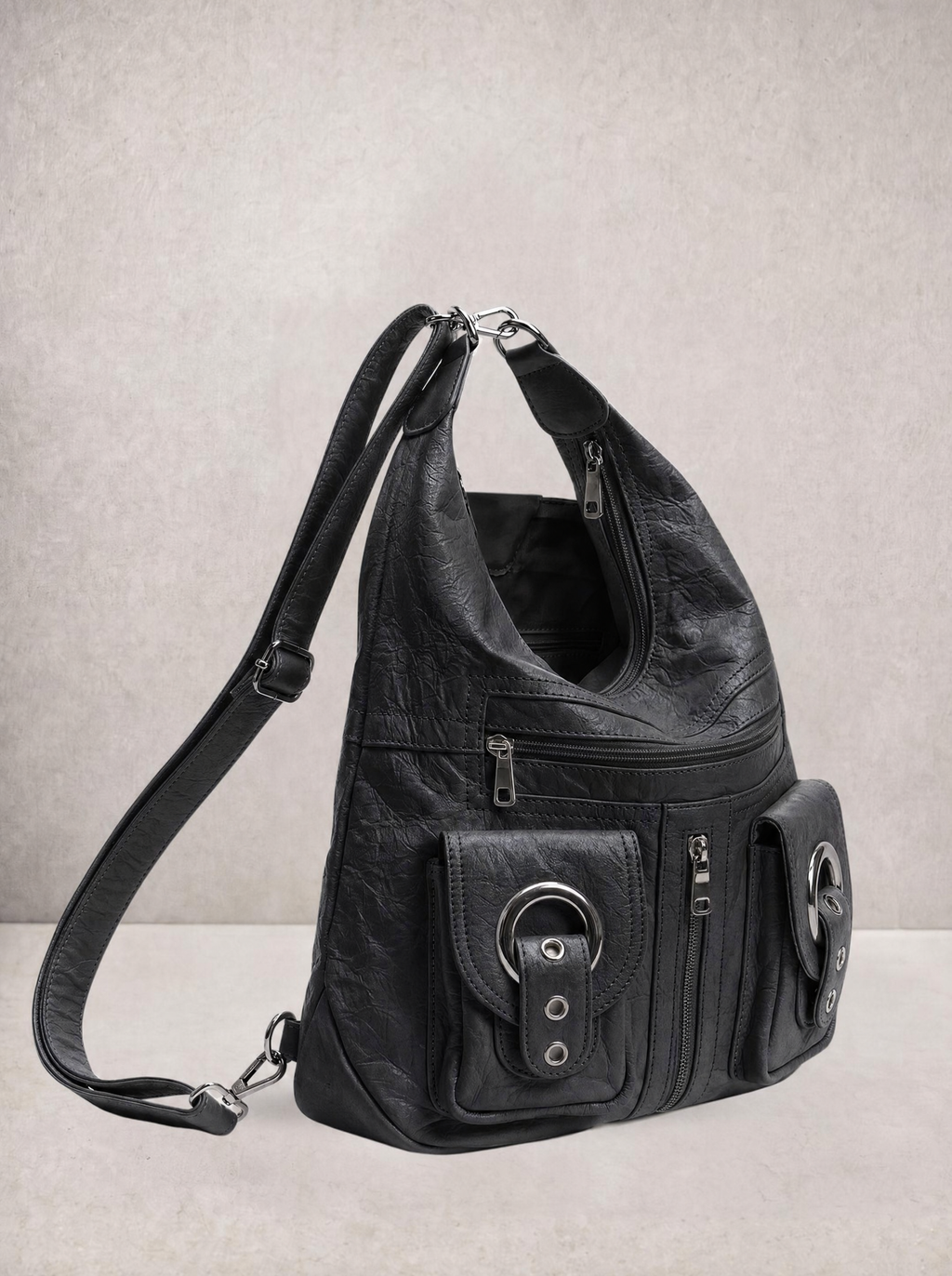 Model wearing the Le Mila black bag as a backpack