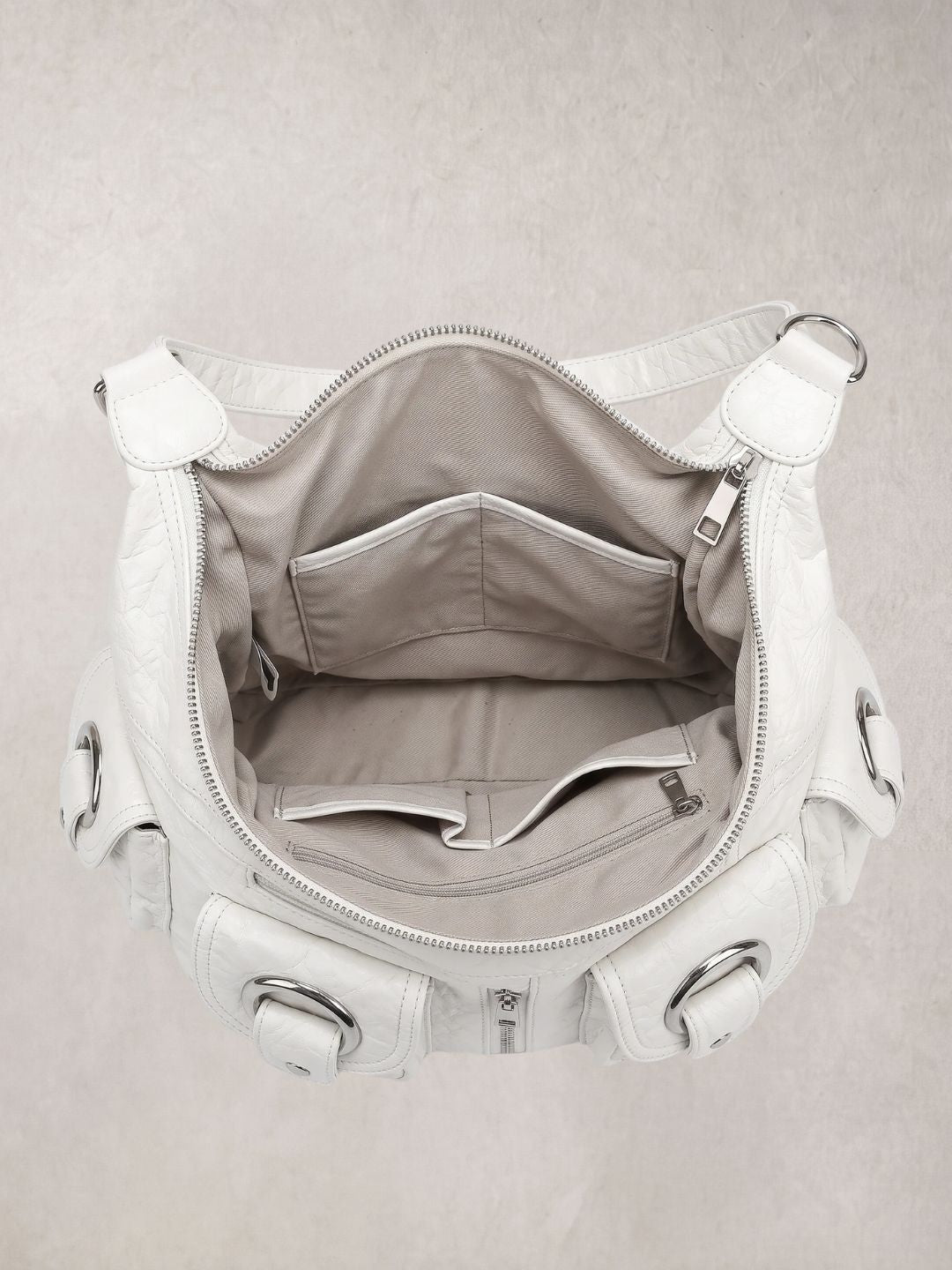 Le Mila white bag open showing the spacious interior