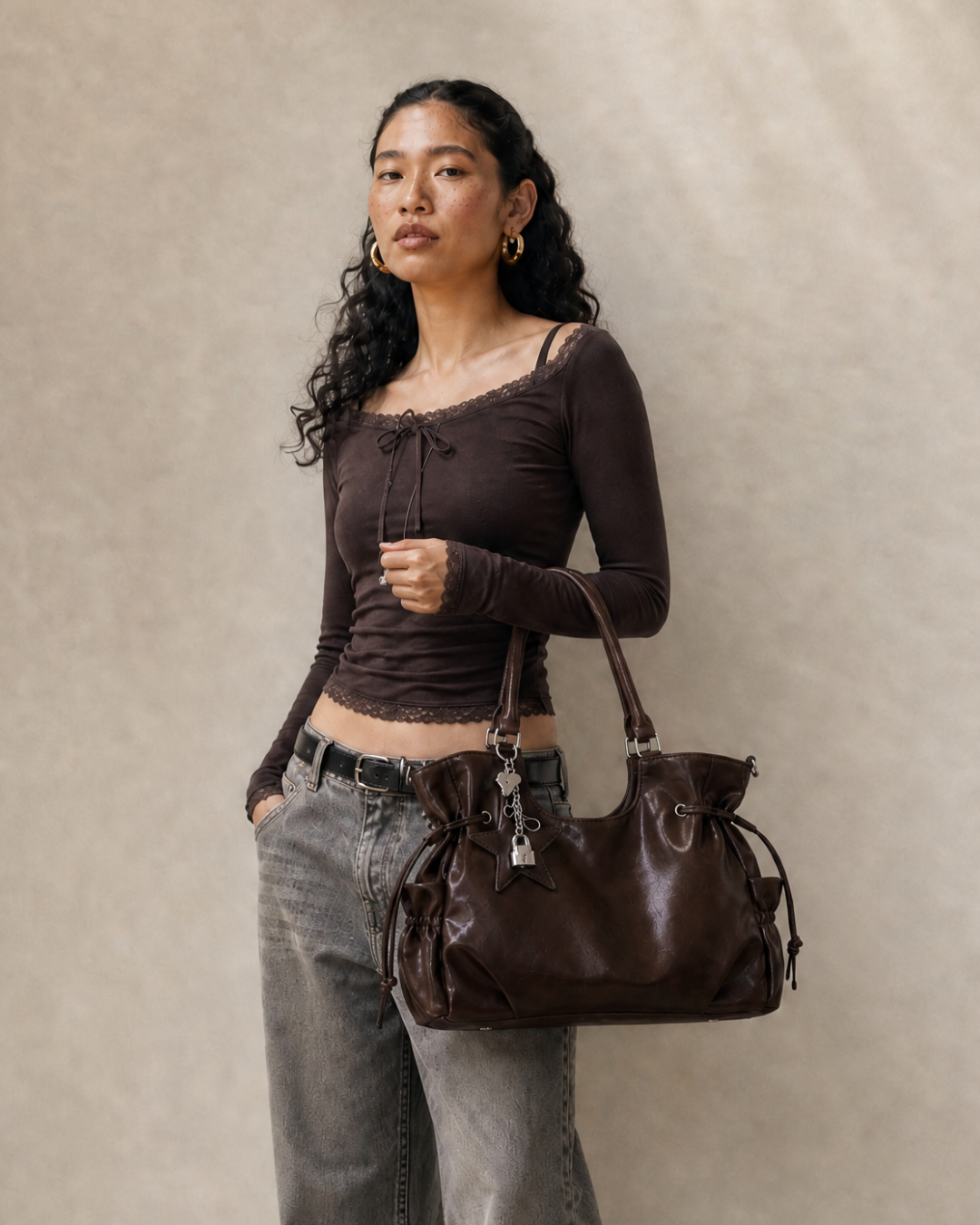 Model wearing the Le Nova brown tote bag on her shoulder, alternate view
