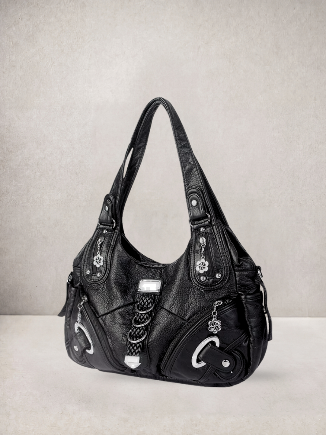Le Nyx hobo bag in black vegan leather with silver hardware, front view