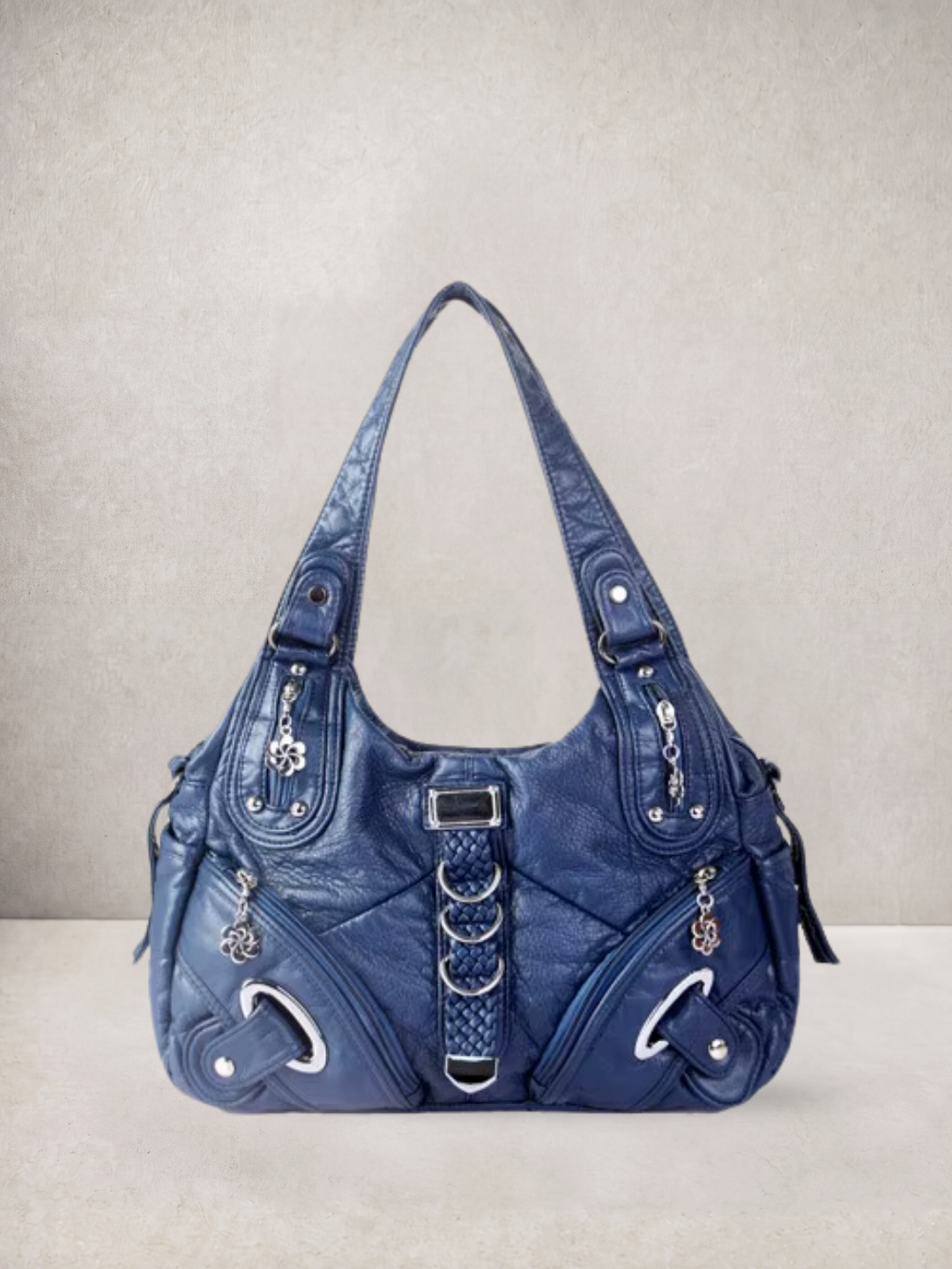 Le Nyx hobo bag in blue vegan leather with silver hardware, front view