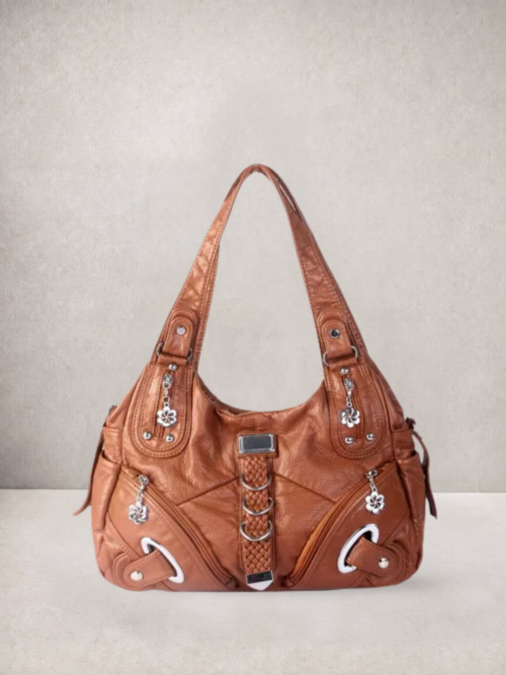 Le Nyx hobo bag in brown vegan leather with silver hardware, front view