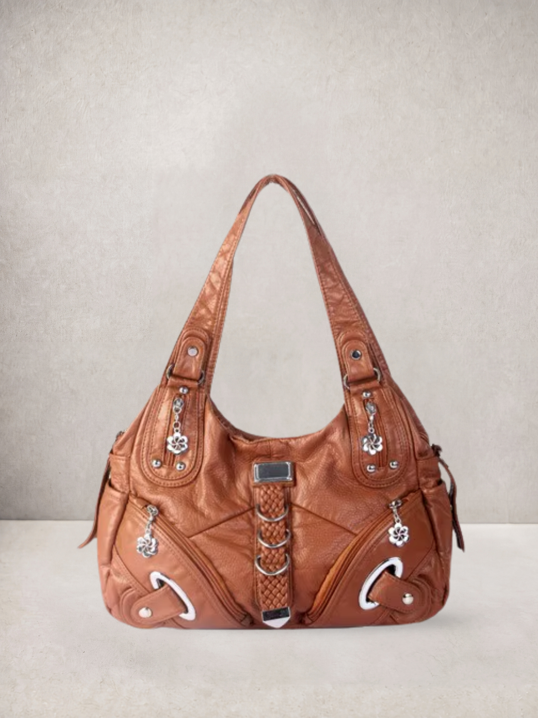 Le Nyx hobo bag in brown vegan leather with silver hardware, front view