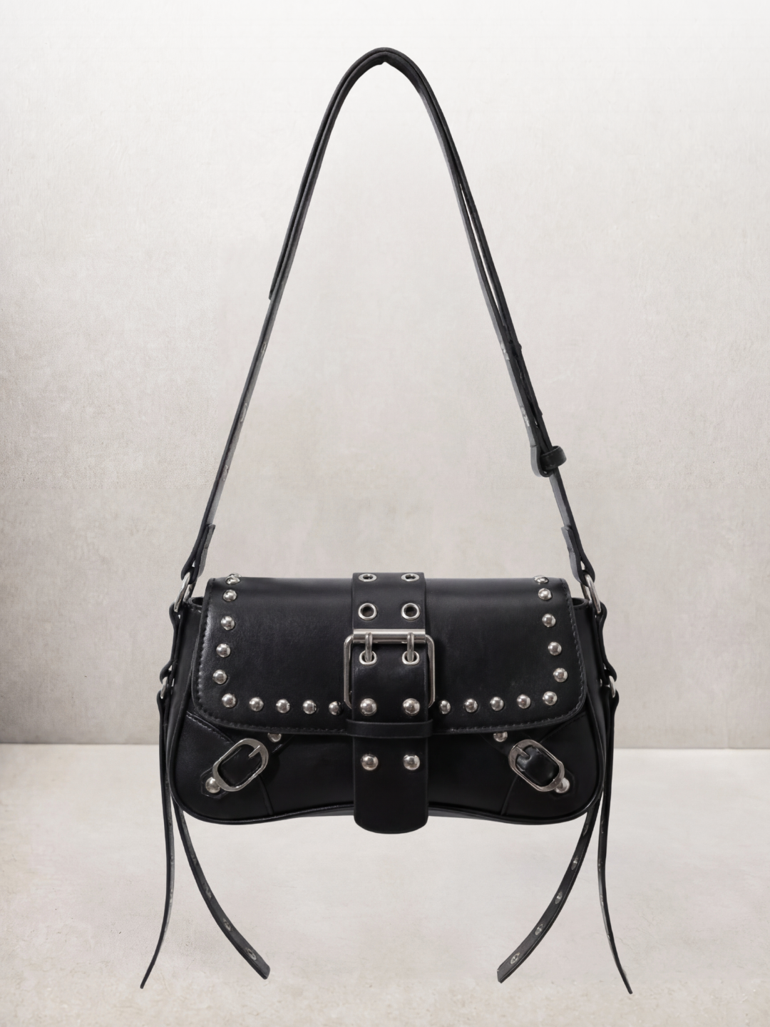Le Robin bag in black vegan leather with stud details, front view