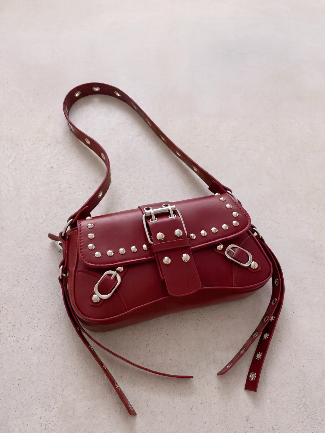 Le Robin bag in burgundy vegan leather with stud details, front view