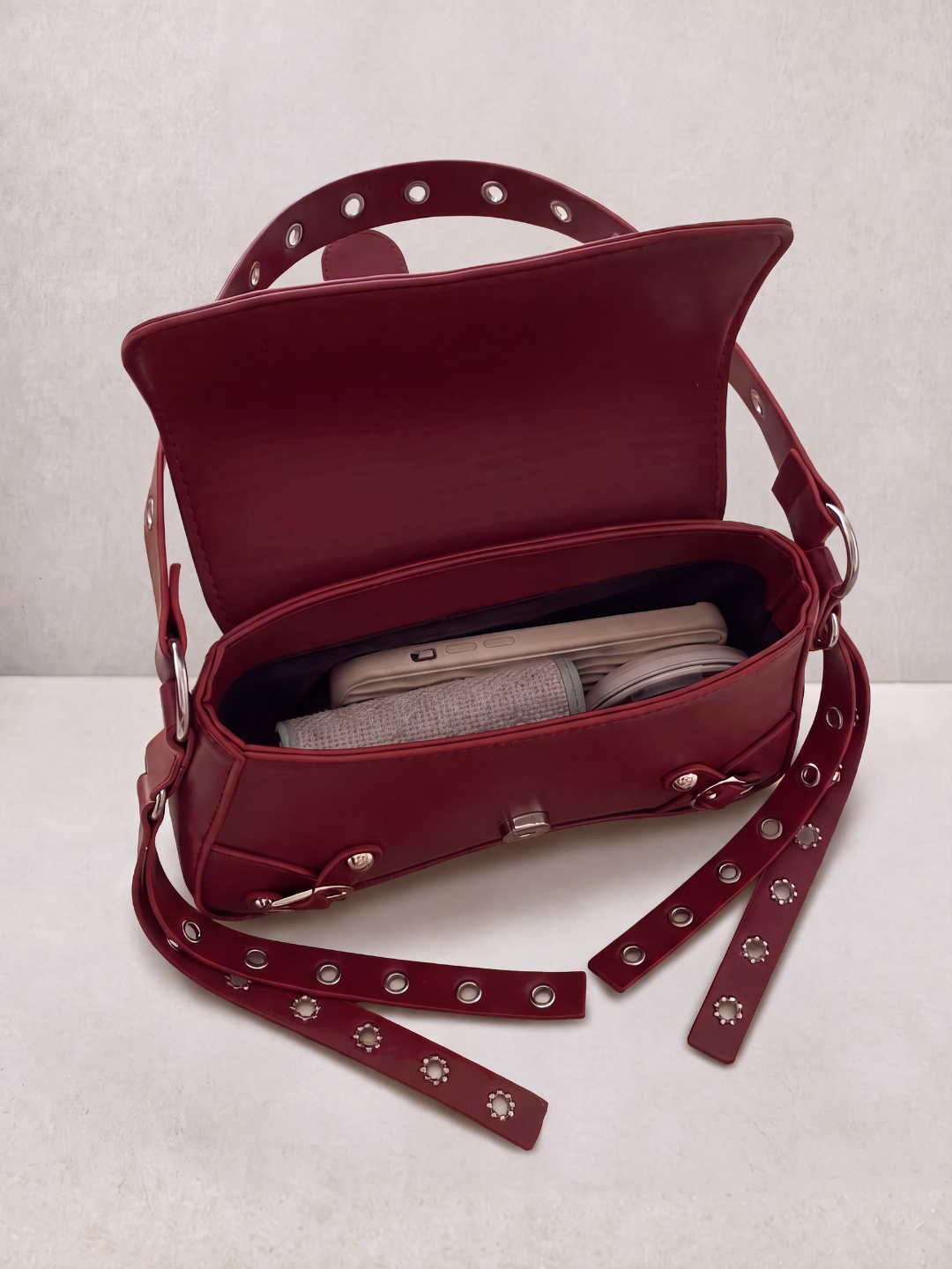 Le Robin burgundy bag open showing the interior compartment