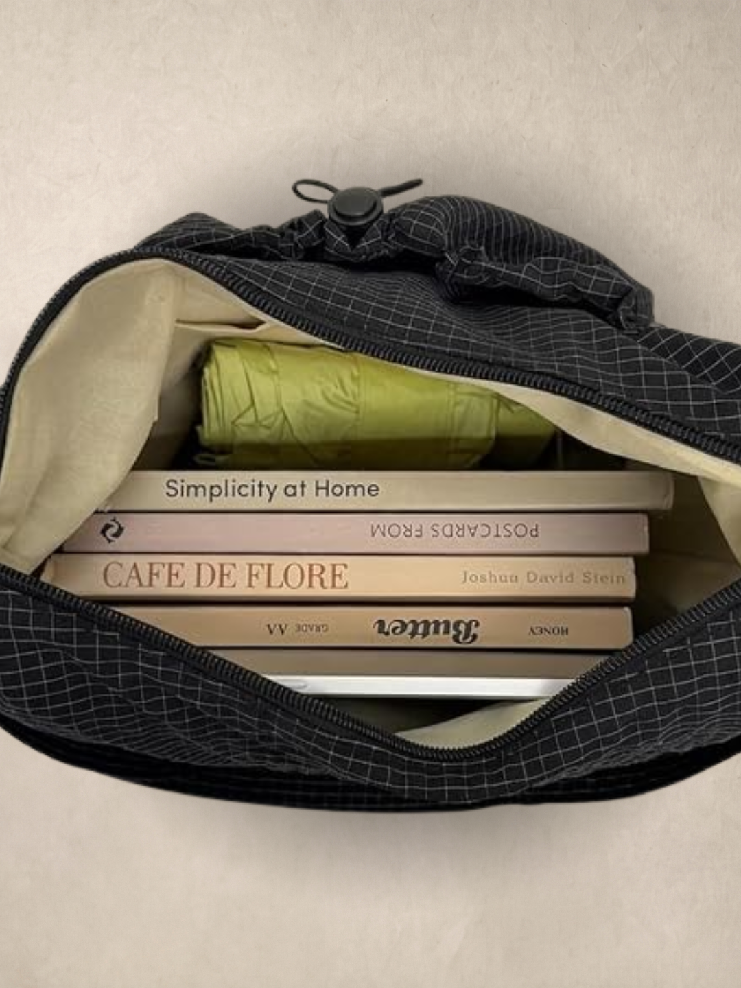 Le Rue black hobo bag open showing the interior with books