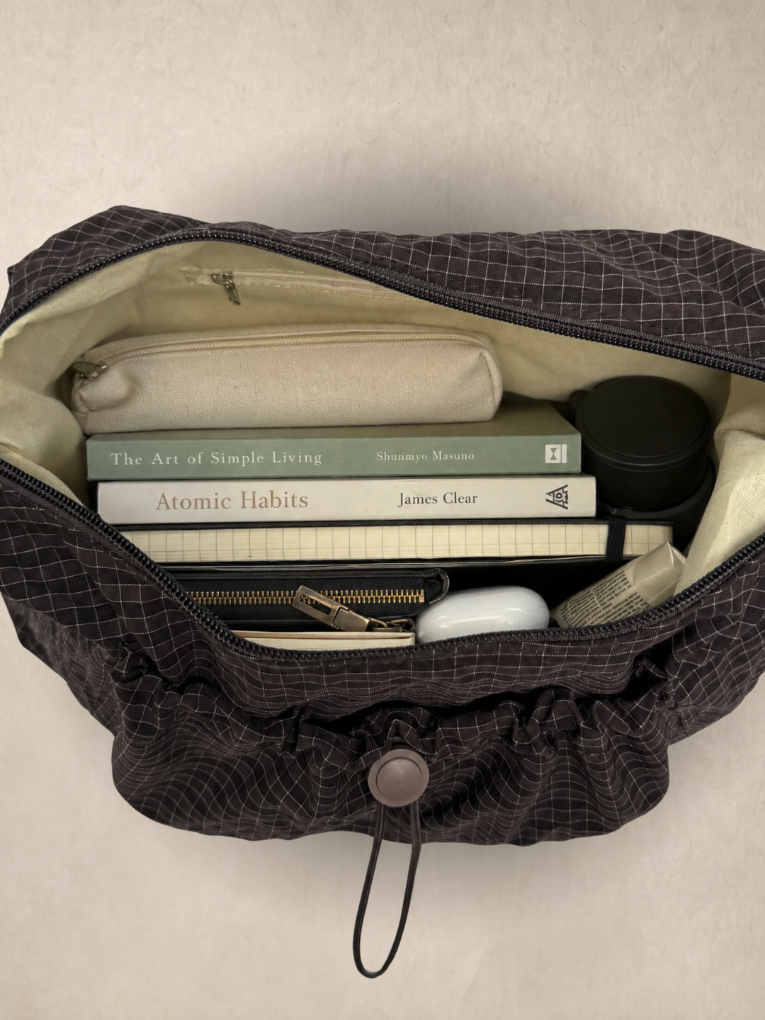 Le Rue brown hobo bag open showing the interior with everyday items