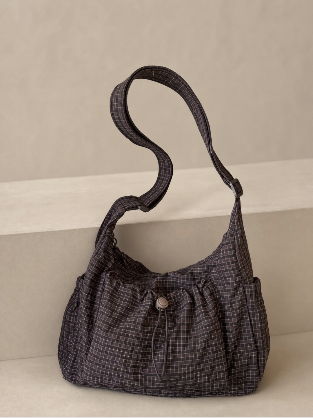 Le Rue hobo bag in brown vegan leather, side view