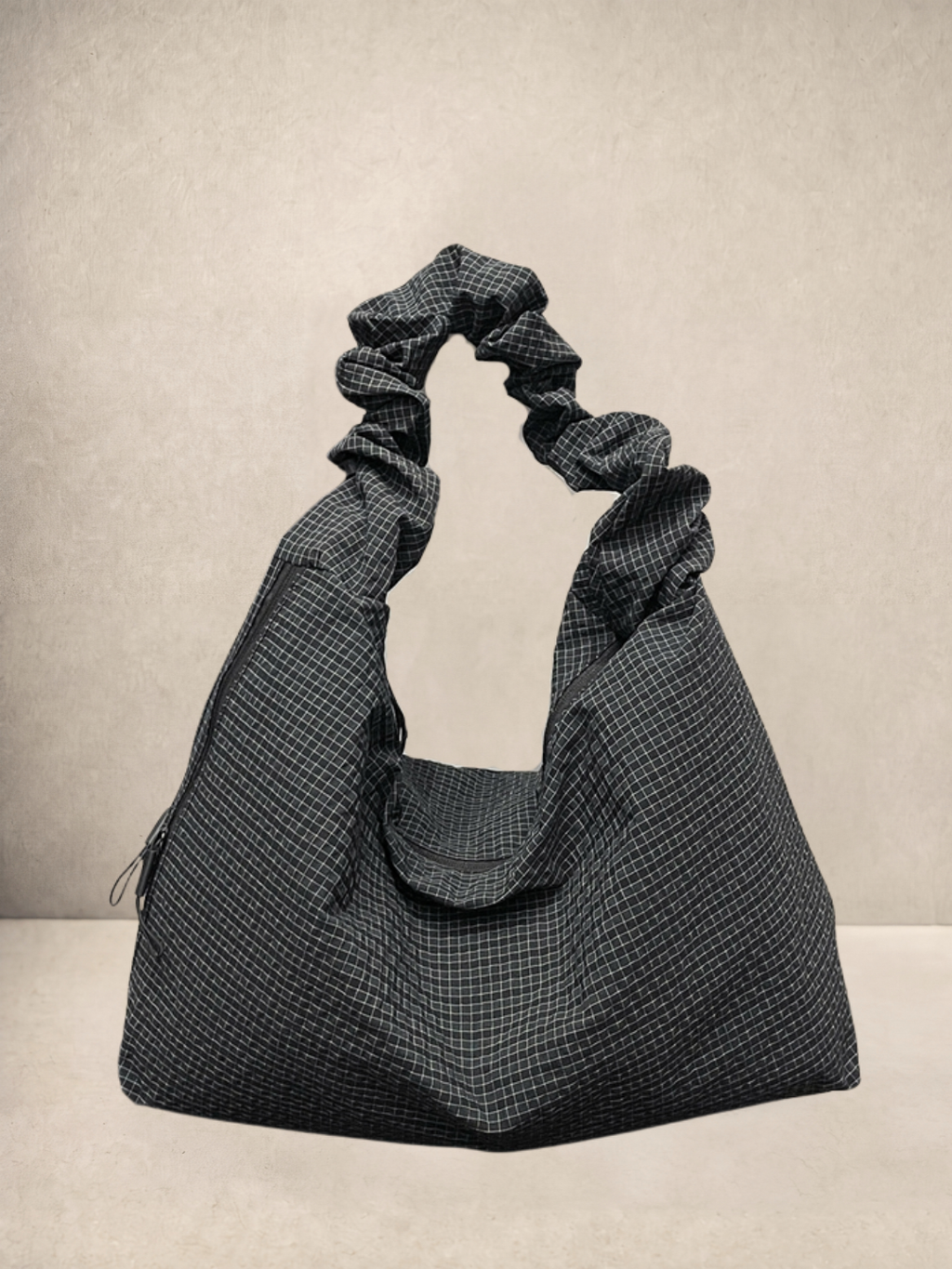 Le Scrunchie hobo bag in black checkered ripstop fabric, front view