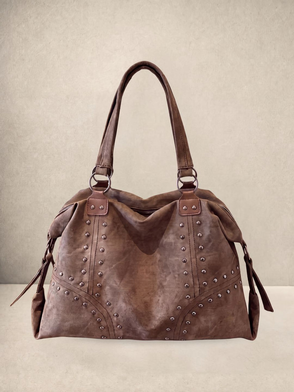 Le Solene shoulder bag in coffee vegan leather with stud details, front view