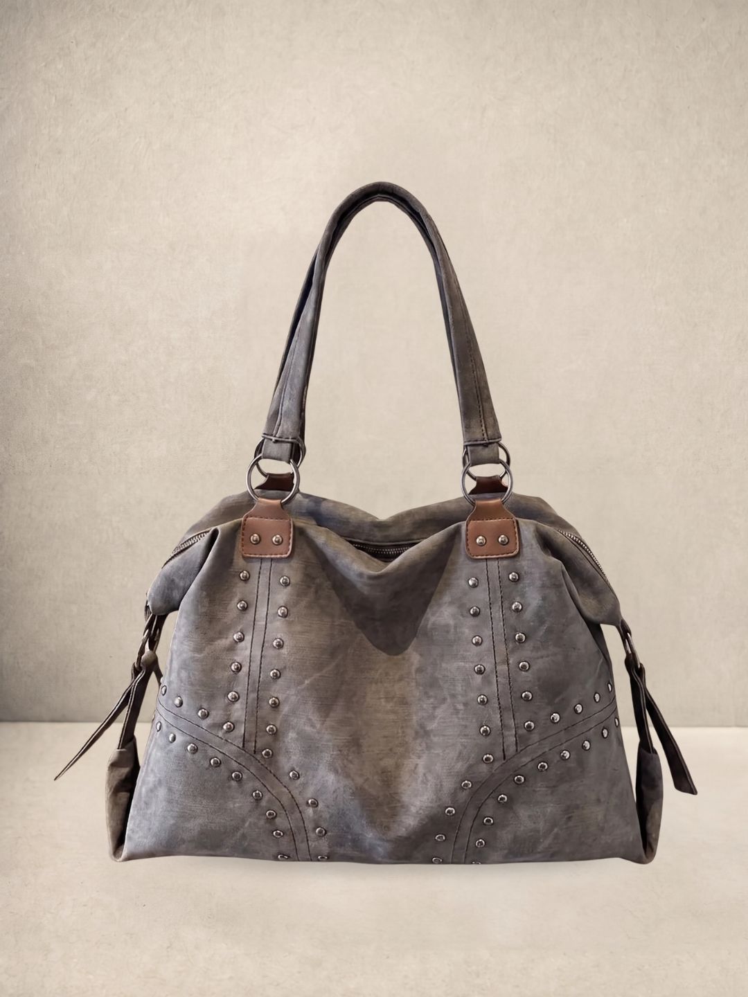 Le Solene shoulder bag in gray vegan leather with stud details, front view