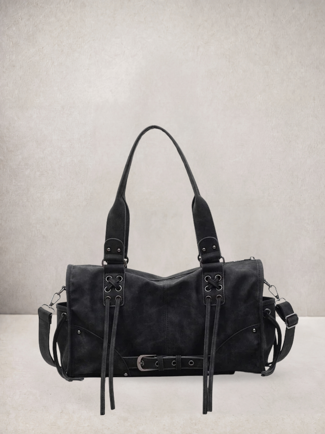 Le Stormie tote bag in black vegan leather with fringe tassel straps, front view