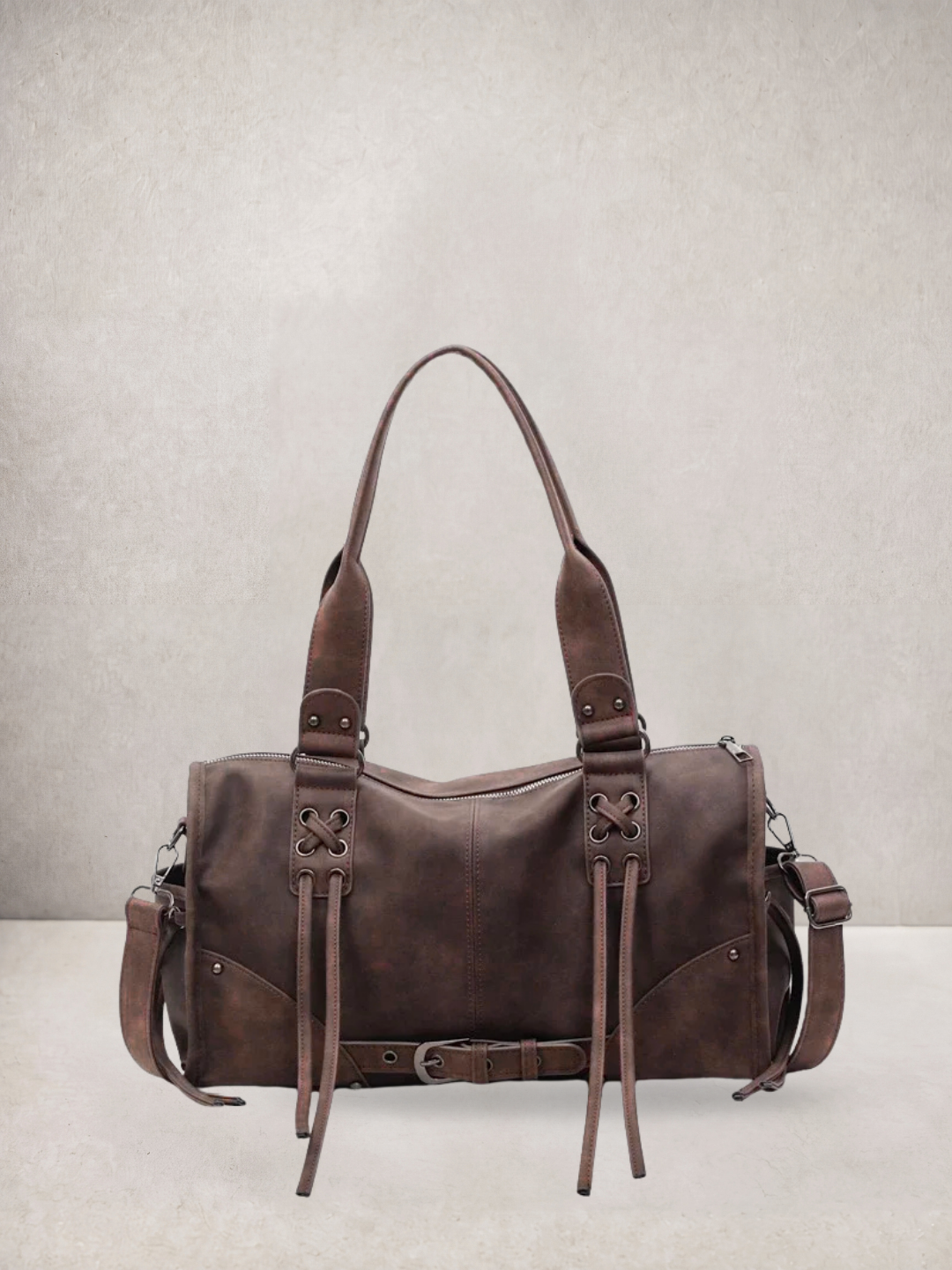 Le Stormie tote bag in brown vegan leather with fringe tassel straps, alternate front view