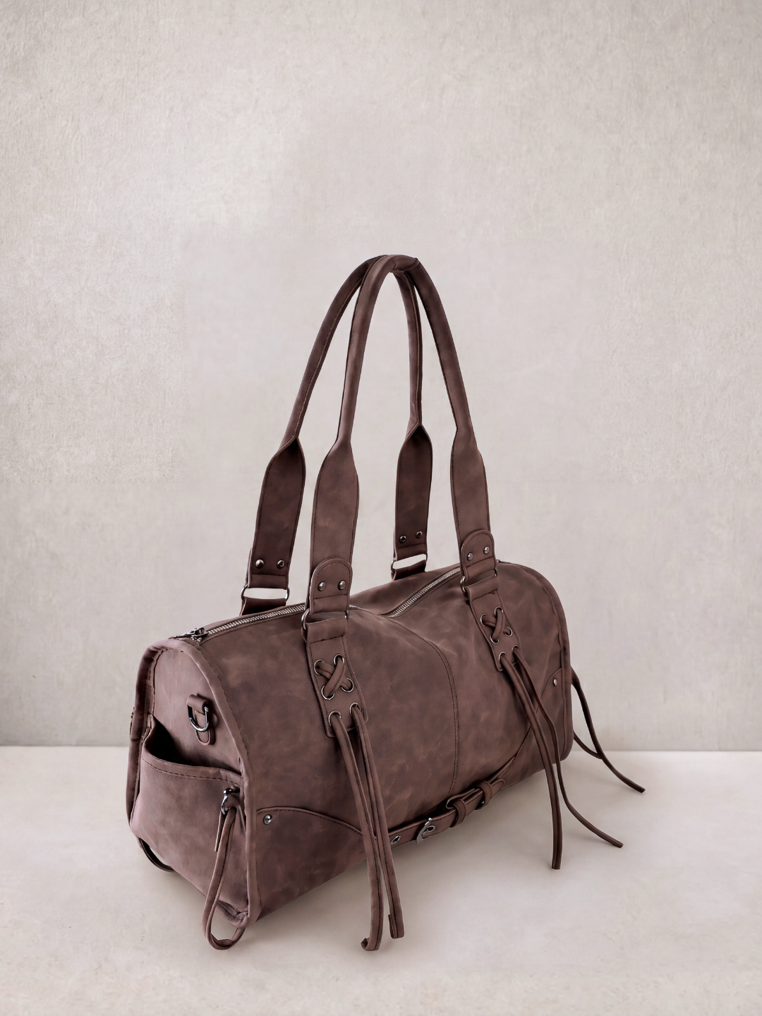 Le Stormie tote bag in brown vegan leather with fringe tassel straps, front view