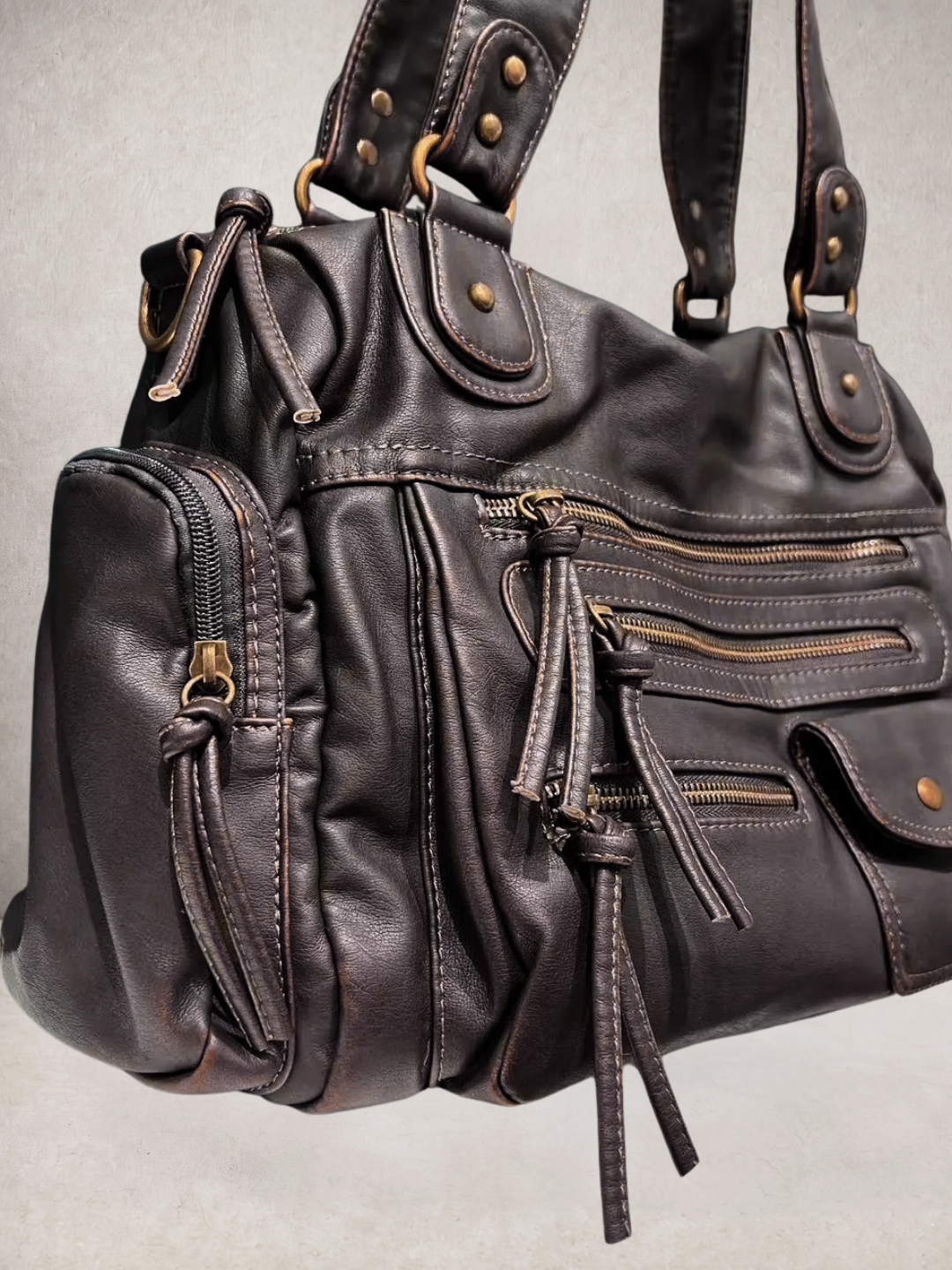 Le Vienne tote bag in dark brown vegan leather, detail view showing pockets and straps