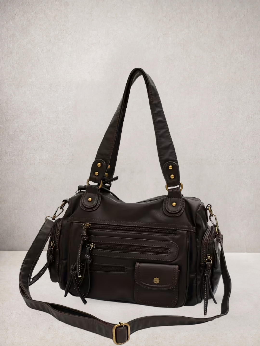 Le Vienne tote bag in dark brown vegan leather with crossbody strap extended, side view