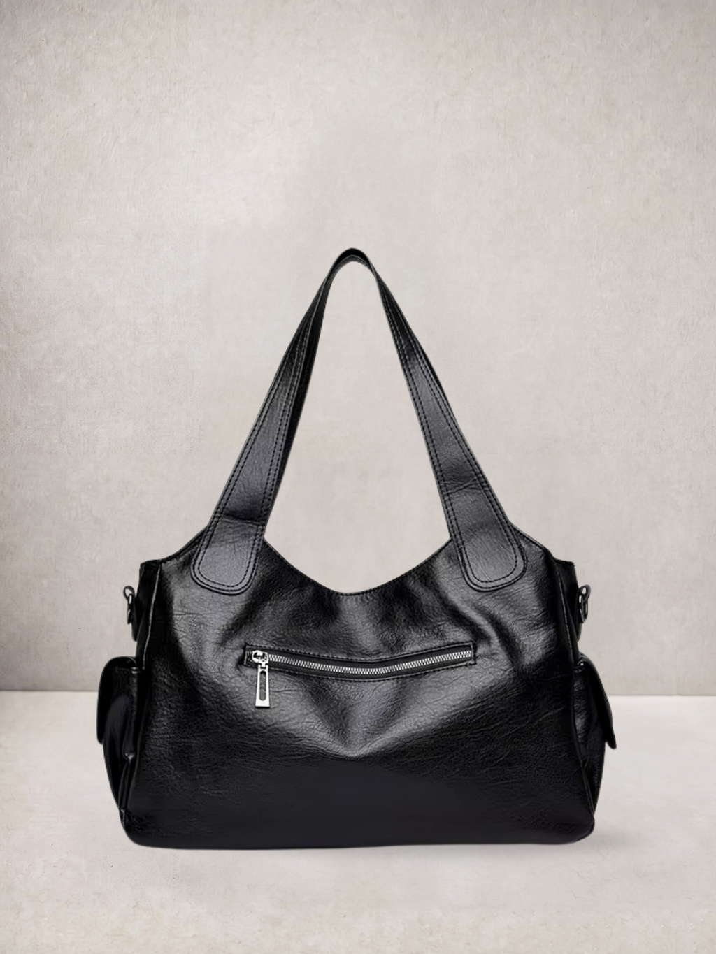 L'Elyn tote bag in black vegan leather, close-up front view