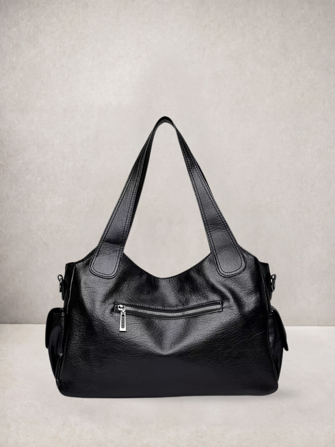 L'Elyn tote bag in black vegan leather, close-up front view