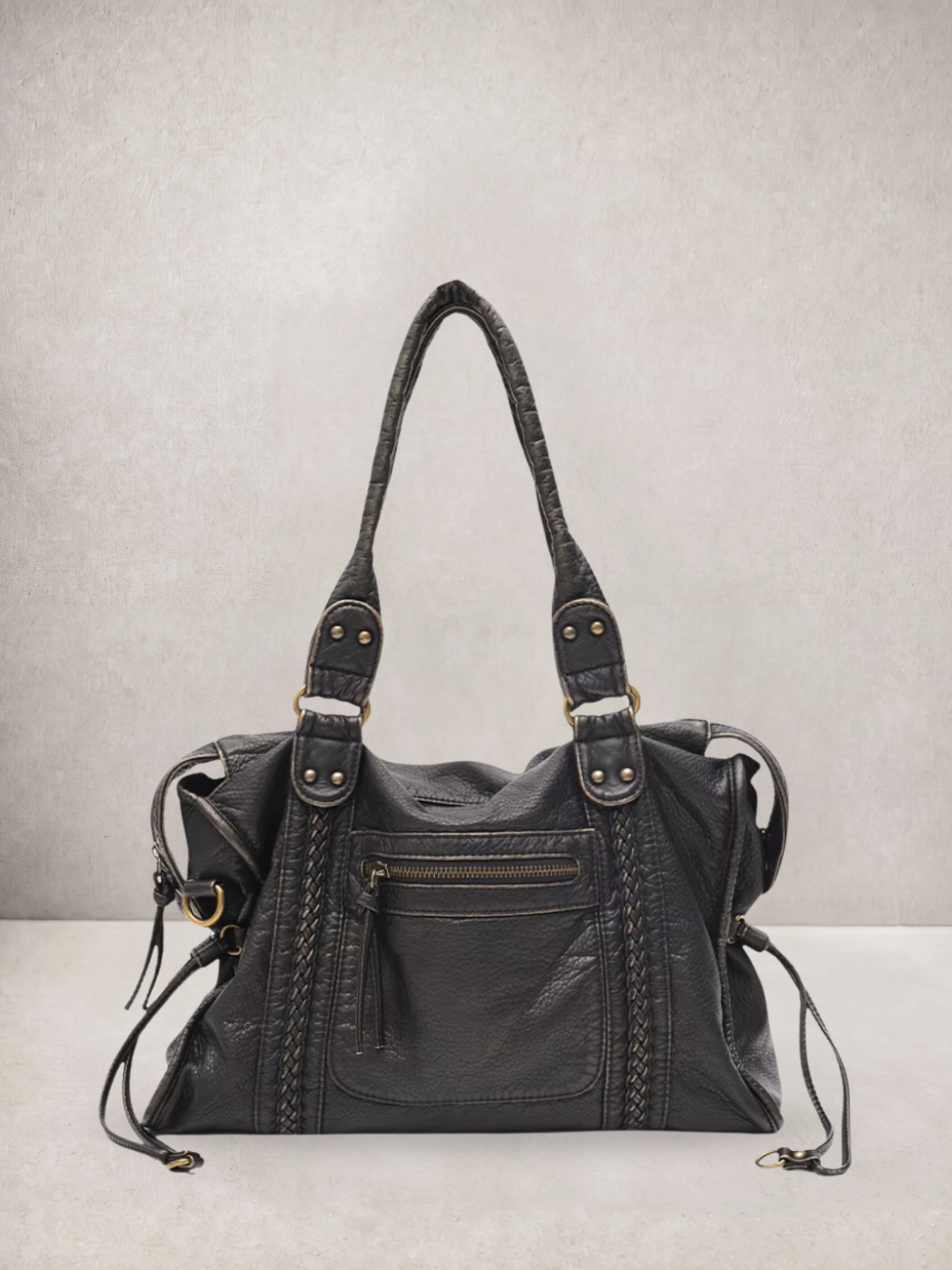 Le Rogue tote bag in black vegan leather with stud details, front view